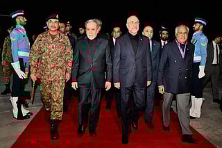 Pakistan's Foreign Minister Ishaq Dar (2nd R) and Army Chief Syed Asim Munir (2nd L) walking with Iran's Foreign Minister Abbas Araghchi (centre L) and Iran’s Parliament Speaker Mohammad Bagher Ghalibaf (centre R) upon their arrival at Nur Khan air base in Rawalpindi.