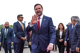 US Vice President JD Vance (C) gestures upon his arrival for the US-Iran peace talks in Islamabad on April 11, 2026.