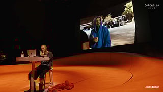 Justin Bieber played songs off his laptop during the concert and flashed memes onscreen.