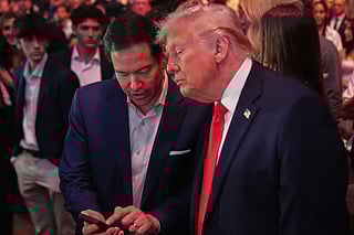 US President Donald Trump speaks with Secretary of State Marco Rubio at UFC 327 in Miami, on April 11, 2026.