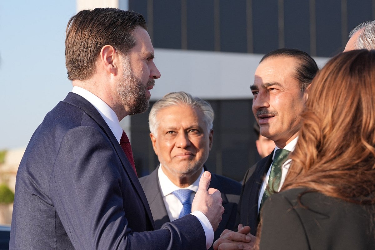 US Vice President JD Vance (left) talks to Pakistan's Chief of Defence Forces and Chief of Army Staff Field Marshall Asim Munir (right) and Pakistan's Deputy Prime Minister and Foreign Minister Mohammad Ishaq Dar before boarding Air Force Two after attending talks on Iran in Islamabad on April 12, 2026.