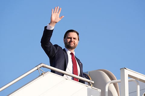 US Vice President JD Vance waves as he boards Air Force Two after attending talks on Iran in Islamabad on April 12, 2026.