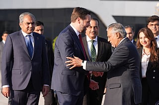 US Vice President JD Vance (C) shakes hands with Pakistani Deputy Prime Minister and Foreign Minister Mohammad Ishaq Dar (3rd R), as Pakistan's Interior Minister Mohsin Naqvi (L), Pakistan's Chief of Defence Forces Chief of Army Staff Field Marshall Asim Munir (centre R) and Charge d'Affaires of the U.S. Embassy in Islamabad Natalie A. Baker (2nd R) look on, as he prepares to board Air Force Two after attending talks on Iran in Islamabad on April 12, 2026.