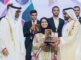 Fatima Alkaabi with His Highness Sheikh Mohammed bin Rashid Al Maktoum, Vice President, Prime Minister and Ruler of Dubai, and UAE President His Highness Sheikh Mohamed bin Zayed Al Nahyan.