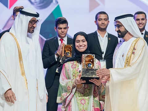 Fatima Alkaabi with His Highness Sheikh Mohammed bin Rashid Al Maktoum, Vice President, Prime Minister and Ruler of Dubai, and UAE President His Highness Sheikh Mohamed bin Zayed Al Nahyan.