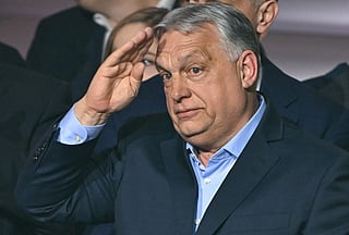Hungary's Prime Minister Viktor Orban salutes supporters at the Balna centre in Budapest during a general election in Hungary, on April 12, 2026.