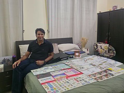 Imtiaz Qureshi with his UAE flag-themed stamps.