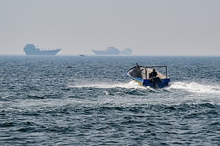 A boat sails in the waters of the Strait of Hormuz off Khasab in Oman’s northern Musandam peninsula on June 25, 2025.