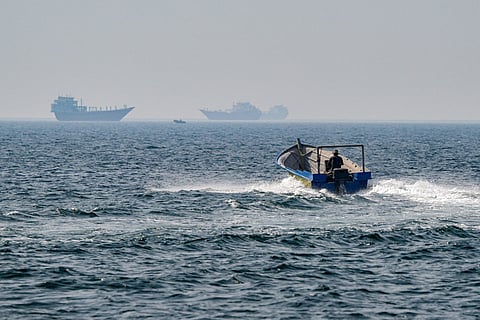 A boat sails in the waters of the Strait of Hormuz off Khasab in Oman’s northern Musandam peninsula on June 25, 2025.