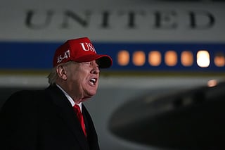 President Donald Trump speaks with reporters at Joint Base Andrews, Md., Sunday, April 12, 2026, after he returned from Miami. (AP Photo/Julia Demaree Nikhinson)