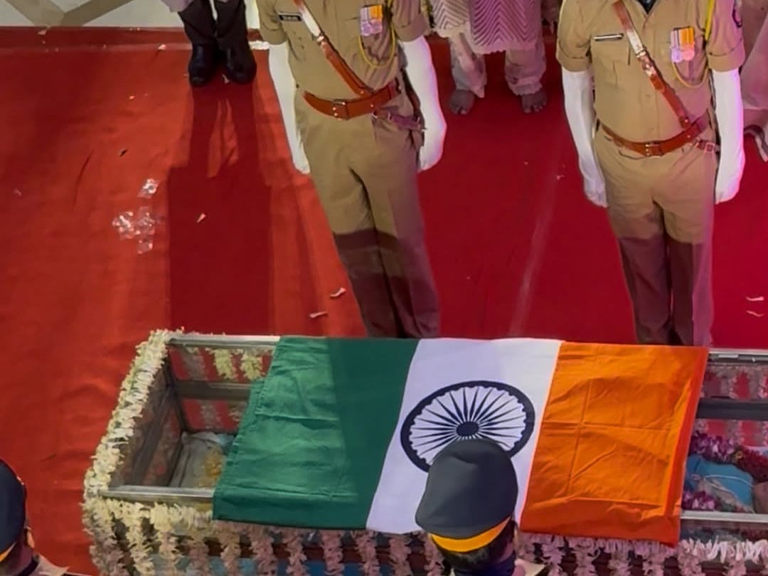 Mortal remains of Asha Bhosle being wrapped in tricolour flag as people pay their last respects at her residence in Mumbai.