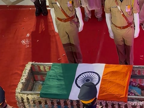 Mortal remains of Asha Bhosle being wrapped in tricolour flag as people pay their last respects at her residence in Mumbai.