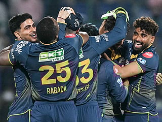 Gujarat Titans' players celebrate after winning against Delhi Capitals at the end of their 2026 IPL match in the Arun Jaitley Stadium of New Delhi on April 8, 2026.