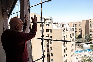 A resident in a building hit by US-Israel airstrikes days before a two-week ceasefire between Iran and the United States took effect, in southern Tehran.