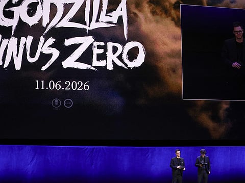 Interpreter Michael McNamara and Japanese director Takashi Yamazaki present the movie "Godzilla Minus Zero" during "The State of the Industry" and NEON presentation at CinemaCon at The Colosseum at Caesars Palace in Las Vegas, Nevada, on April 14, 2026.
