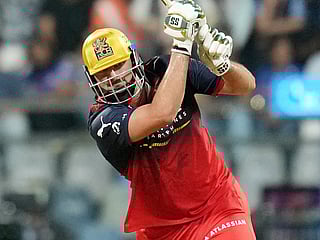 Royal Challengers Bengaluru's Tim David plays a shot during the Indian Premier League cricket match against Mumbai Indians, in Mumbai, on Sunday, April 12, 2026. 