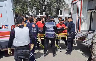 First aid officers carrying a body bag in Kahramanmaras, southern Turkey.