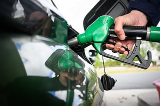 A man fills in his car with petrol at a gas station in Saint-Etienne-de-Montluc, western France, on April 15, 2026, as US-Israel war on Iran, launched on February 28, has roiled global energy and equities markets, sending oil prices skyrocketing after Tehran virtually closed the key Strait of Hormuz.