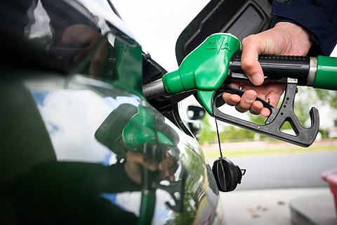 A man fills in his car with petrol at a gas station in Saint-Etienne-de-Montluc, western France, on April 15, 2026, as US-Israel war on Iran, launched on February 28, has roiled global energy and equities markets, sending oil prices skyrocketing after Tehran virtually closed the key Strait of Hormuz.