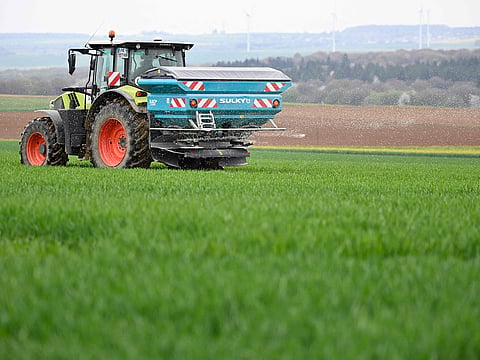 A farmer carries out the centrifugal spreading of ammonium nitrate on a field in Angevillers, northeastern France on April 10, 2026. 
