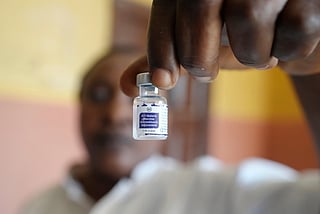 A health worker shows a bottle of the malaria vaccine R21/Matrix-M before administering it to a child at the comprehensive Health Centre in Agudama-Epie, in Yenagoa, Nigeria, on Dec. 9, 2024. 