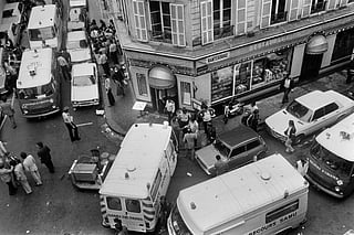 View of firemen and a rescuers in the rue des Rosiers after the French-Jewish delicatessen restaurant Jo Goldenberg was attacked on August 9, 1982 in Paris by gunmen that threw a grenade into the restaurant and shot at customers with sub-machine guns, killing six customers and injuring 22 others.