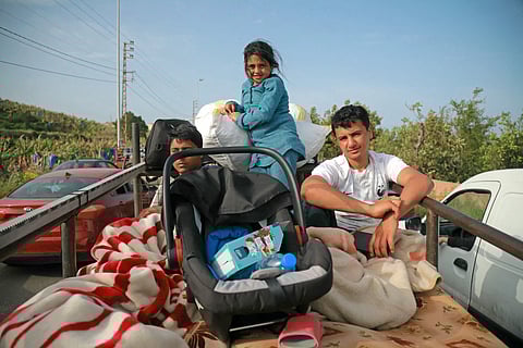 Lebanese cross destroyed bridge at sunrise to reach south after ceasefire