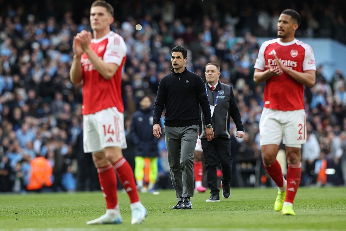 Arsenal's Spanish manager Mikel Arteta (C) reacts at the end of the English Premier League football match between Manchester City and Arsenal at the Etihad Stadium in Manchester, north west England, on April 19, 2026.