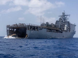 Sailors and Marines aboard the USS Rushmore (LSD-47) carry out blockade operations in the Arabian Sea.