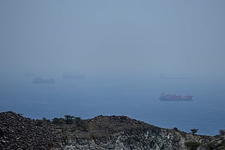 Tankers and bulk carriers anchored in the Strait of Hormuz, Saturday, April 18, 2026. 