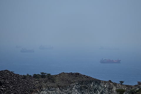 Tankers and bulk carriers anchored in the Strait of Hormuz, Saturday, April 18, 2026. 