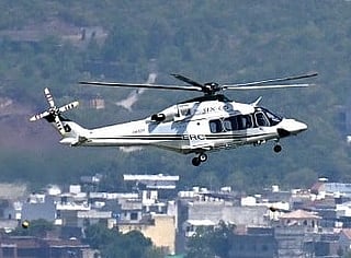 A helicopter flies over the Red Zone area in Islamabad on April 20, 2026, amid heightened security measures ahead of anticipated US-Iran peace talks.