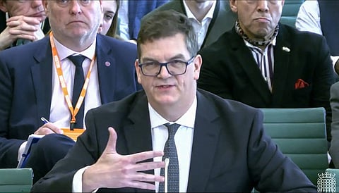 In this video grab taken from footage broadcast by the UK Parliamentary Recording Unit (PRU) via the Parliament TV website on April 21, 2026, former permanent under-secretary at the Foreign, Commonwealth and Development Office (FCDO), Olly Robbins (c), speaks on the work of the FCDO in the Boothroyd Room at Portcullis House, Westminster in London.