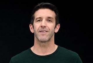 This handout released and taken on November 10, 2020 by Apple inc. shows Apple's vice president of Hardware Engineering John Ternus unveiling M1, the first chip designed specifically for the Mac during a special event at Apple Park in Cupertino, California.