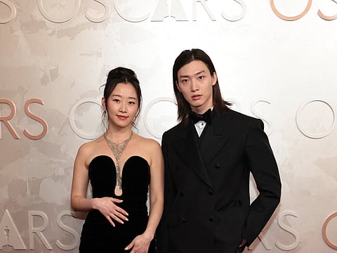 Gia Kim and Sang Heon Lee at the 97th Annual Oscars at Dolby Theatre on March 02, 2025 in Hollywood, California.