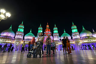 Visitors arrive during the night time at season 30 of Global Village which reopened after a month-long pause. 