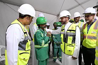 Officials review facilities and engage workers at Arab Construction Company site in Dubai