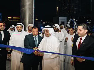Sheikh Hasher Bin Maktoum Bin Juma Al Maktoum (second from right), Chairman of Dubai Media Incorporated, Mohamed Adib Hijazi (third from right), Chairman of HRE Development, and guests at the handover ceremony