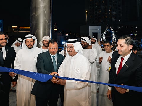 Sheikh Hasher Bin Maktoum Bin Juma Al Maktoum (second from right), Chairman of Dubai Media Incorporated, Mohamed Adib Hijazi (third from right), Chairman of HRE Development, and guests at the handover ceremony