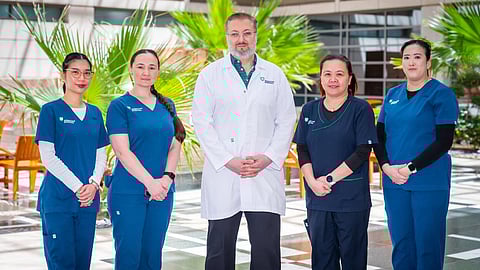 Dr Ayman Tarabishy. Consultant Physical Medicine and Rehabilitation, Brain Injury Medicine and Pain Medicine, with his team at American Hospital Dubai 