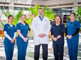 Dr Ayman Tarabishy. Consultant Physical Medicine and Rehabilitation, Brain Injury Medicine and Pain Medicine, with his team at American Hospital Dubai 