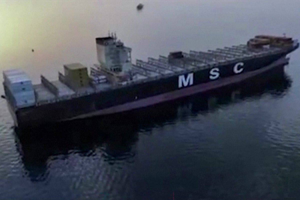 This screen grab taken from undated video footage released by Iran's Revolutionary Guards and made available via Iran's state broadcaster on April 23, 2026, shows a container ship attempting to cross the Strait of Hormuz in the midst of an operation to allegedly seize it by the IRGC's naval forces