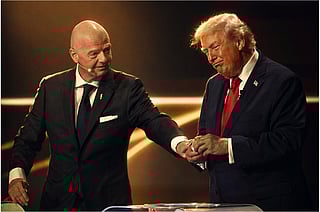 FIFA President Gianni Infantino pauses President Donald Trump during the draw for the 2026 FIFA World Cup at the Kennedy Center in Washington, Friday, Dec. 5, 2025. 