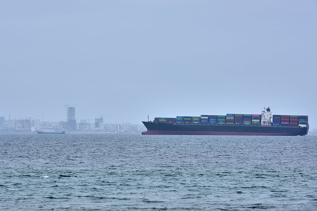 A container ship is seen in the Strait of Hormuz off the coast of Qeshm Island, Iran, Saturday, April 18, 2026.