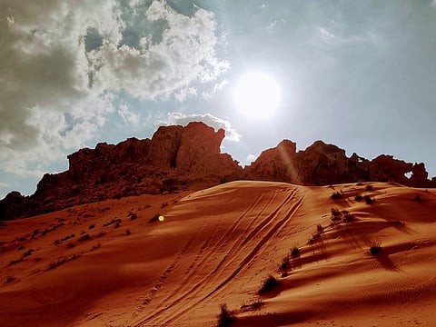 Rising sand and endless sky over the dunes of Maleha in Sharjah, captured beautifully by Lisa Singh.