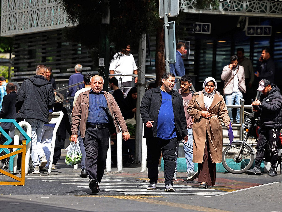 People walk through the Valiasr Square in Tehran. [Illustrative image]