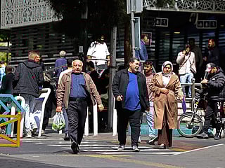 People walk through the Valiasr Square in Tehran. [Illustrative image]