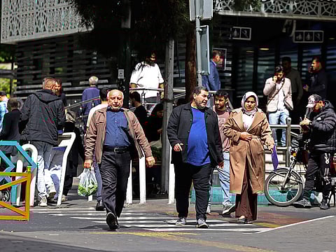 People walk through the Valiasr Square in Tehran. [Illustrative image]