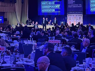 U.S. Secret Service agents respond near President Donald Trump during the White House Correspondents Dinner.