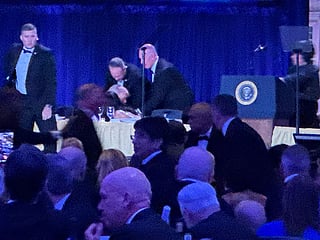 Secret service agents respond during the White House Correspondents Dinner, Saturday in Washington.